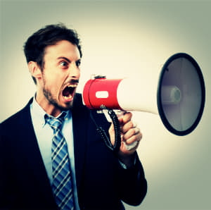 man shouting through megaphone