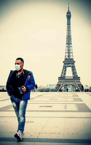 man with COVID mask walking in public space