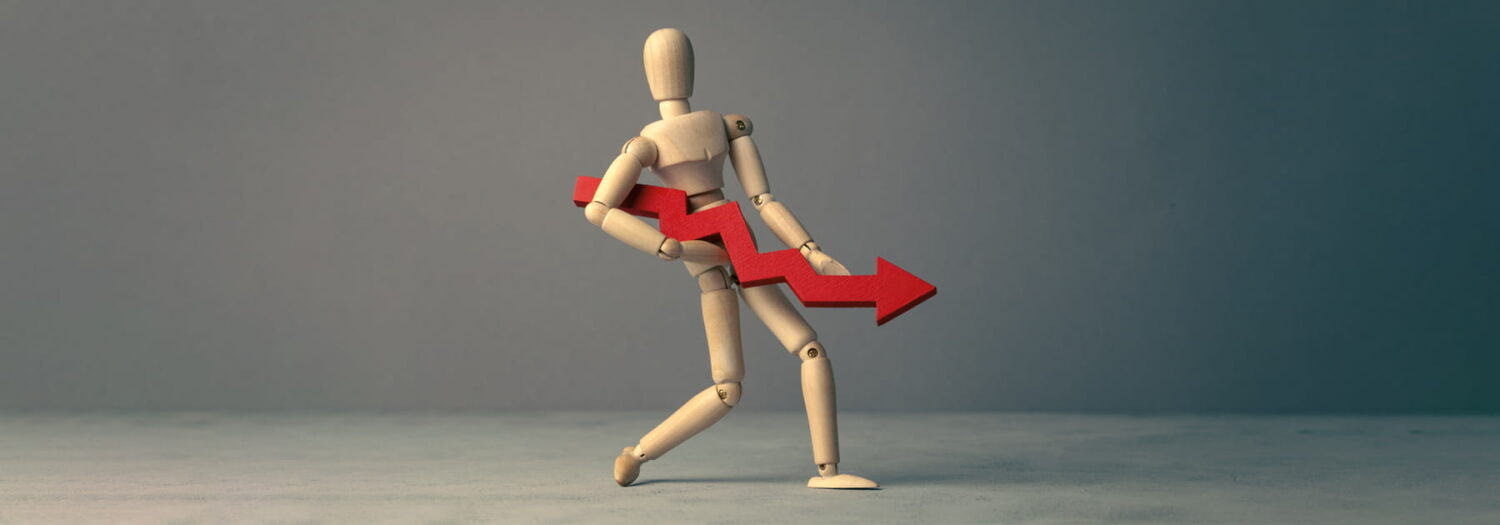 businessman concept holding a downward facing financial graph